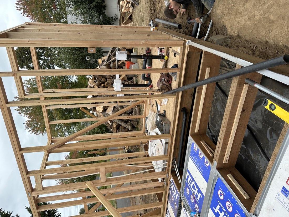 Water and drain lines run through a new-build crawlspace